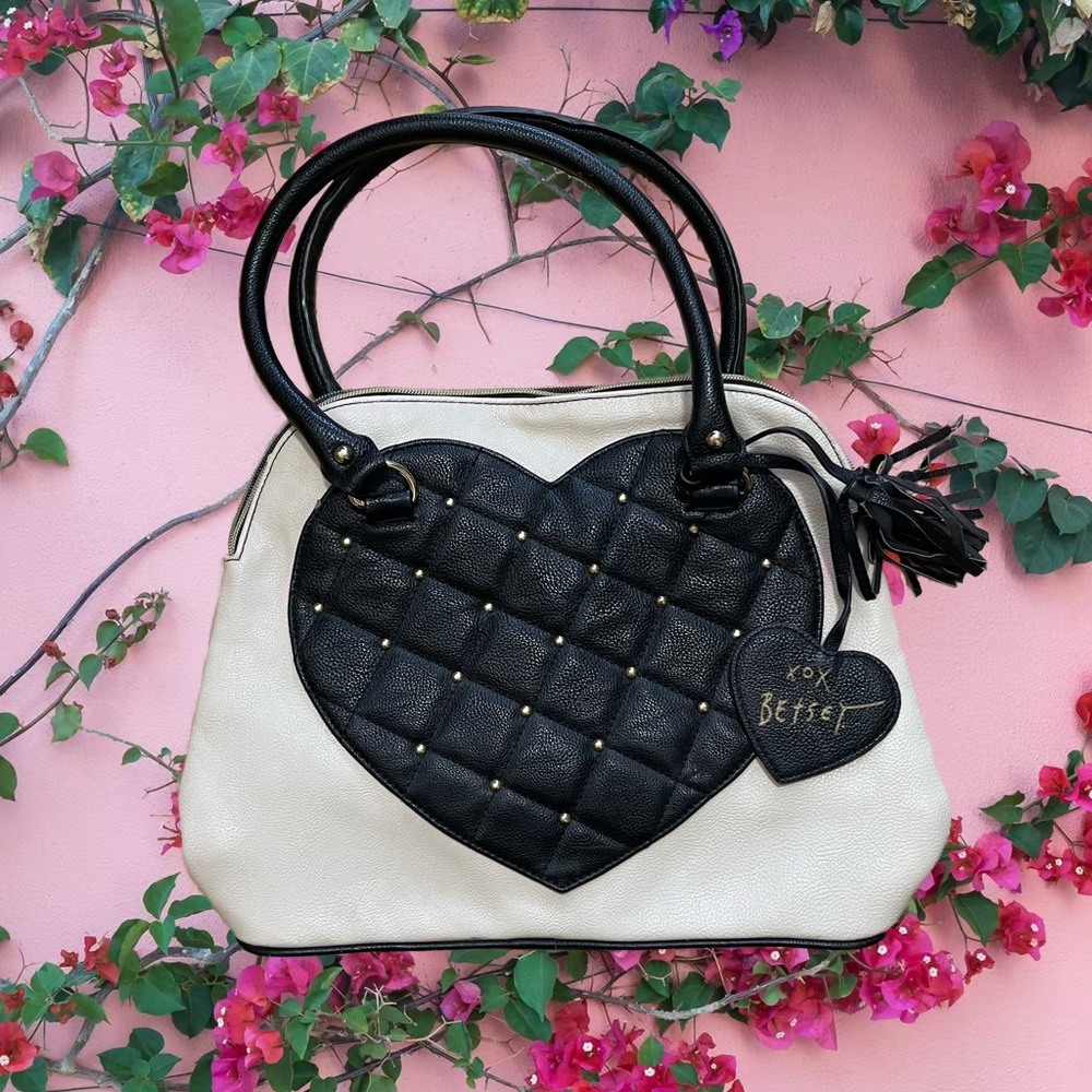 Black and white-cream Bestsey Johnson purse.